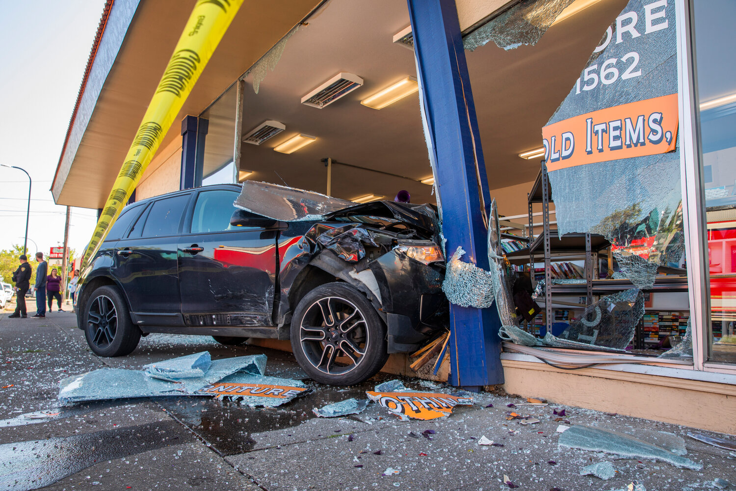 Caution tape surrounds a scene at Visiting Nurses in Centralia after a vehicle crashed through windows, destroying shelves full of items, at the location Thursday morning.