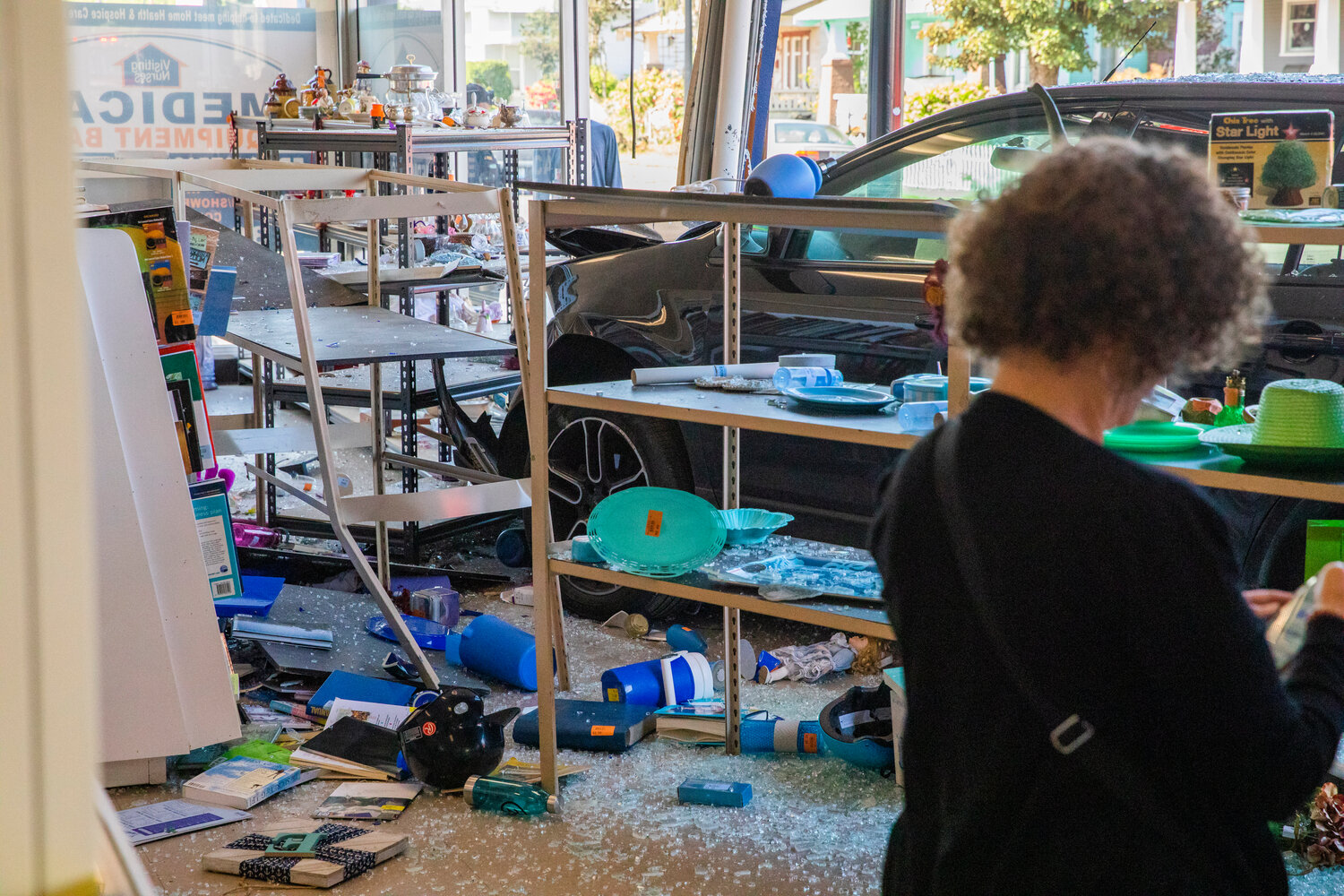 Damaged is accessed at Visiting Nurses in Centralia after a vehicle crashed through windows, destroying shelves full of items, at the location Thursday morning.