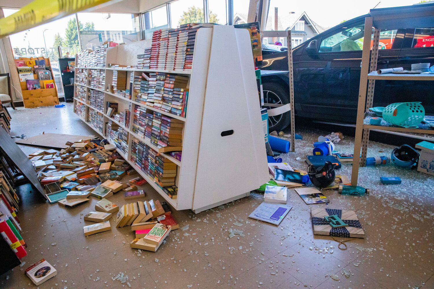 Glass is seen shattered at Visiting Nurses in Centralia after a vehicle crashed through windows, destroying shelves full of items, at the location Thursday morning.
