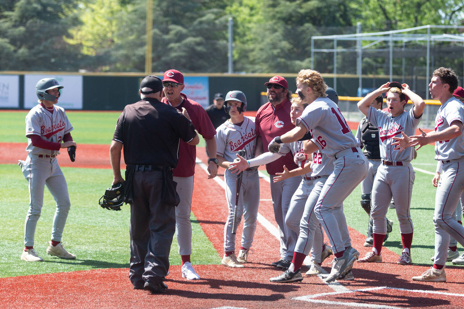 The W.F. West baseball team reacts after finding out the home plate ump ruled Deacon Meller out after stealing home in a 5-4 win over Selah in the 2A state third-place game at Joe Martin Stadium in Bellingham May 27. The umps overturned the call moments later.
