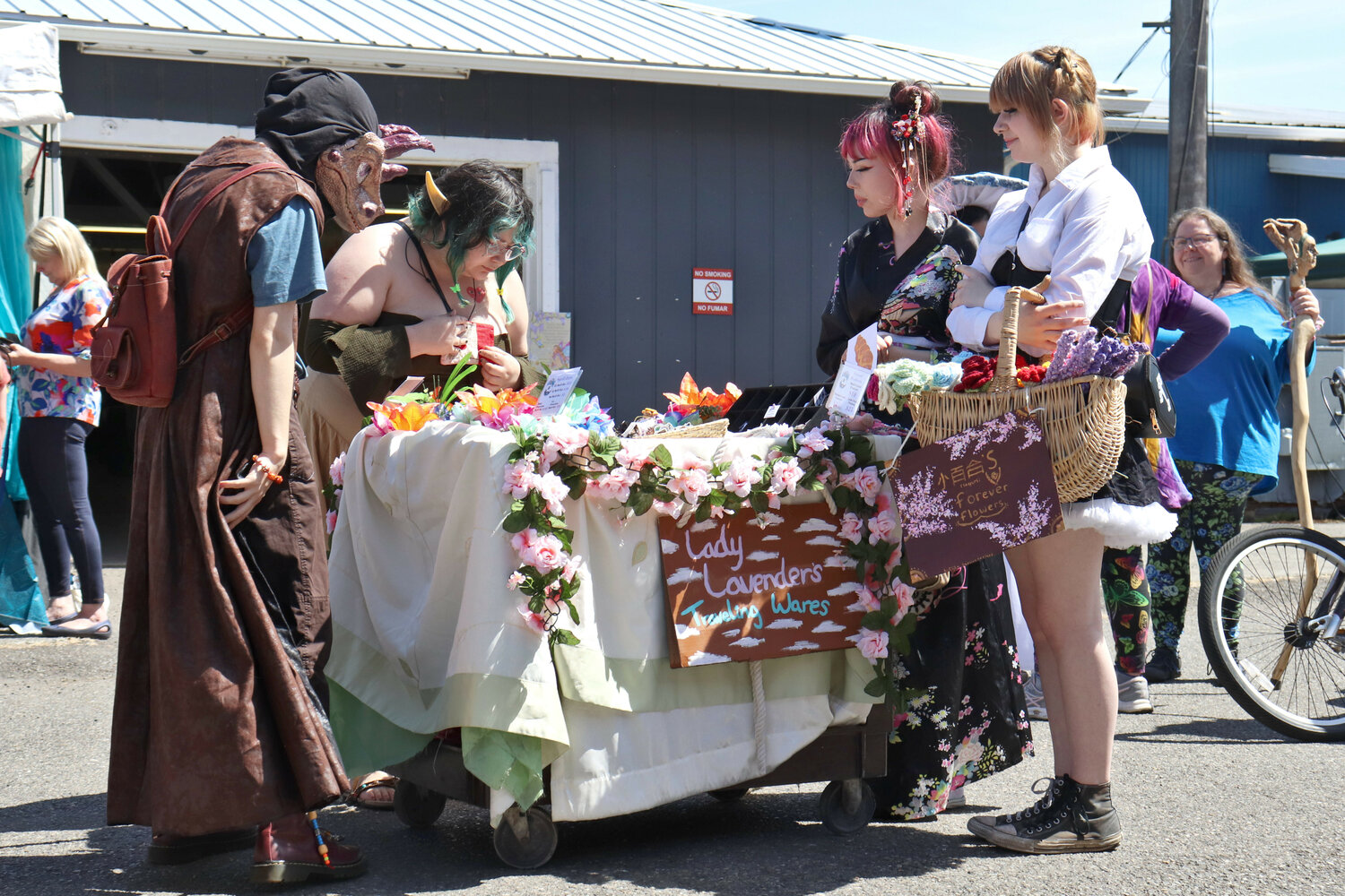 Alexis and Kat Thompson, right, peddle their wares during the Centralia Fantasy Festival at the Southwest Washington Fairgrounds in Chehalis on Saturday, May 27.