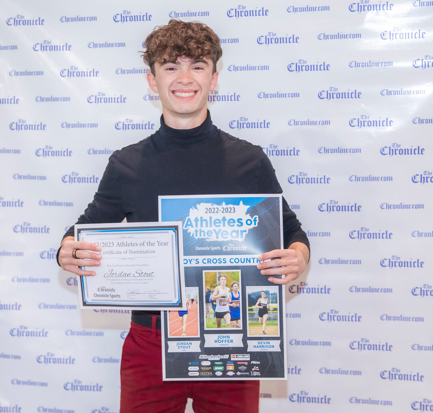 Adna’s Jordan Stout smiles for a photo Tuesday evening during the “Athletes of the Year” banquet at the Jester Auto Museum. Stout won the 1B/2B District 4 Title last fall in Rainier and finished fifth at the 1B/2B State Championships for cross country.
