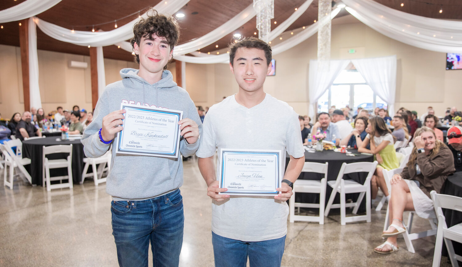 Bearcat tennis standouts Javyn Han and Bryce Kuykendall smile for a photo Tuesday evening during the “Athletes of the Year” banquet at the Jester Auto Museum. Though the pair lost in the district semis, Han and Kuykendall battled through the consolation bracket to finish third in the tournament and earn a State berth in Seattle.