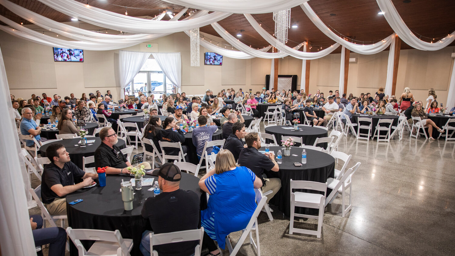 Attendees gather for the “Athletes of the Year” banquet at the Jester Auto Museum in Chehalis on Tuesday, May 30.