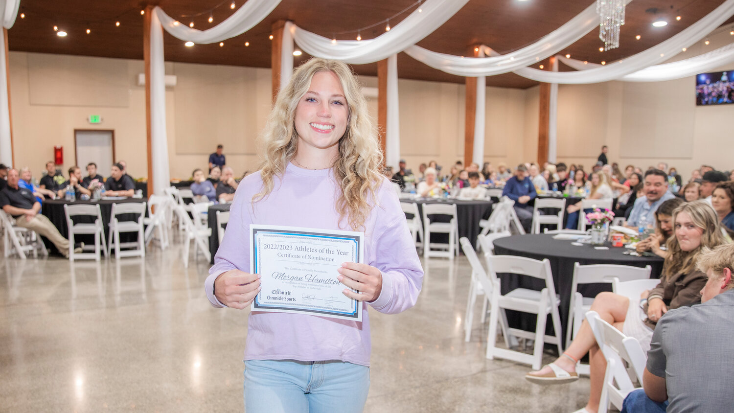 Napavine’s Morgan Hamilton smiles for a photo Tuesday evening during the “Athletes of the Year” banquet at the Jester Auto Museum. Hamilton, a senior, did a bit of everything for the Tigers, totaling 463 digs, 295 kills and 58 aces helping guide a young team to the State tournament.