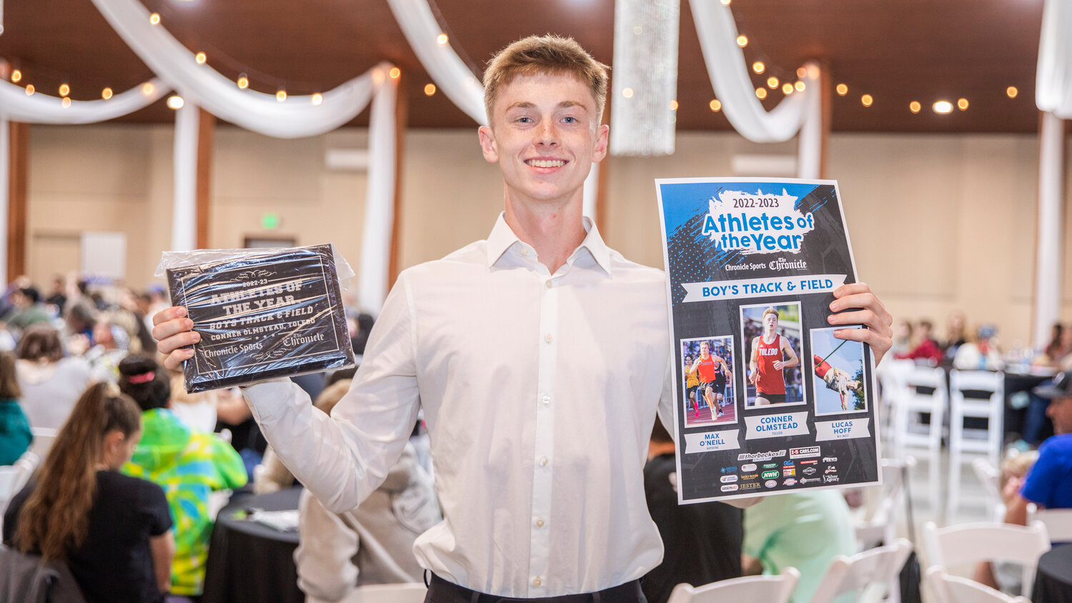 Toledo’s Conner Olmstead smiles for a photo Tuesday evening during the “Athletes of the Year” banquet at the Jester Auto Museum. Olmstead, a four event standout, won two individual District Championships in the 400 meter dash and high jump, while also helping the Riverhawks take State titles in the 4x100 meter and 4x400 meter relays.