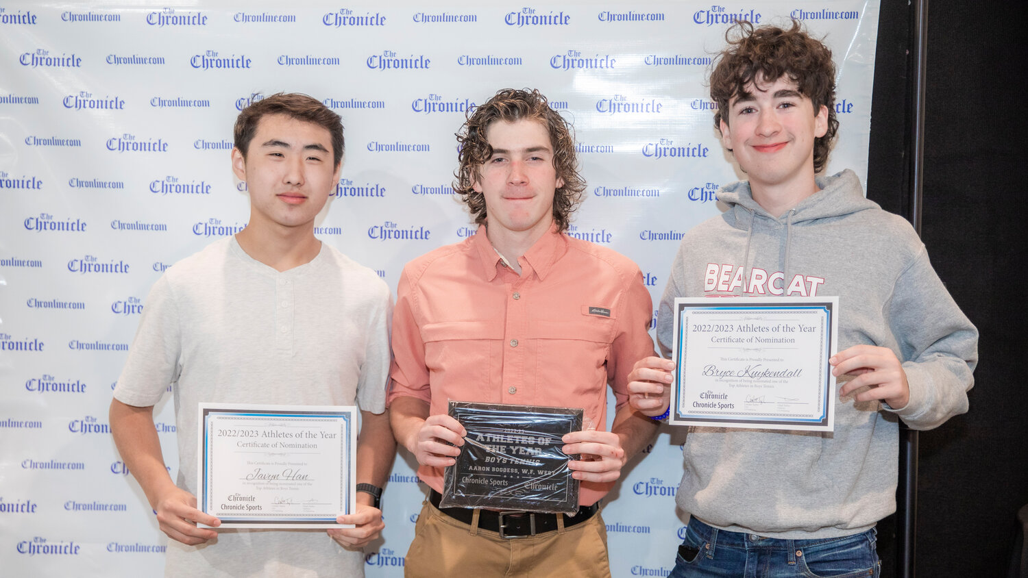 From left, Bearcat tennis standouts Javyn Han, Aaron Boggess and Bryce Kuykendall smile for a photo Tuesday evening during the “Athletes of the Year” banquet at the Jester Auto Museum.