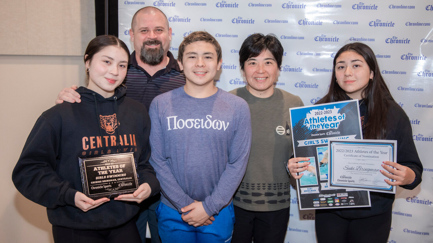 Centralia swimmers Chihiro and Suki Bringman smile for a photo with family Tuesday evening during the “Athletes of the Year” banquet at the Jester Auto Museum. Chihiro finished fourth at State for the 200 meter freestyle and fifth for the 500 meter freestyle after winning a pair of events at the district championships in Shelton. Suki also had a strong season for the Tigers finishing twelfth at State in the 500 meter freestyle and sixteenth in the 50 meter freestyle.