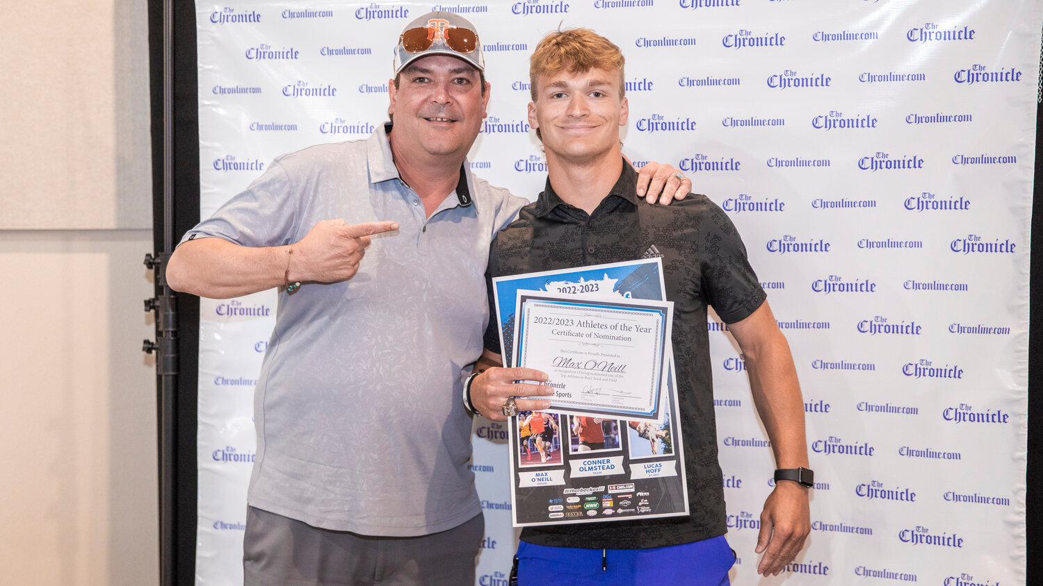 Napavine’s Max O’Neill smiles for a photo with Shawn O’Neill Tuesday evening during the “Athletes of the Year” banquet at the Jester Auto Museum. O’Neill, a four event state qualifier, is one of the most well rounded athletes in the area making it to state as a thrower, jumper and sprinter while being honored alongside James Grose for Napavine’s 2B State Championship win in football.