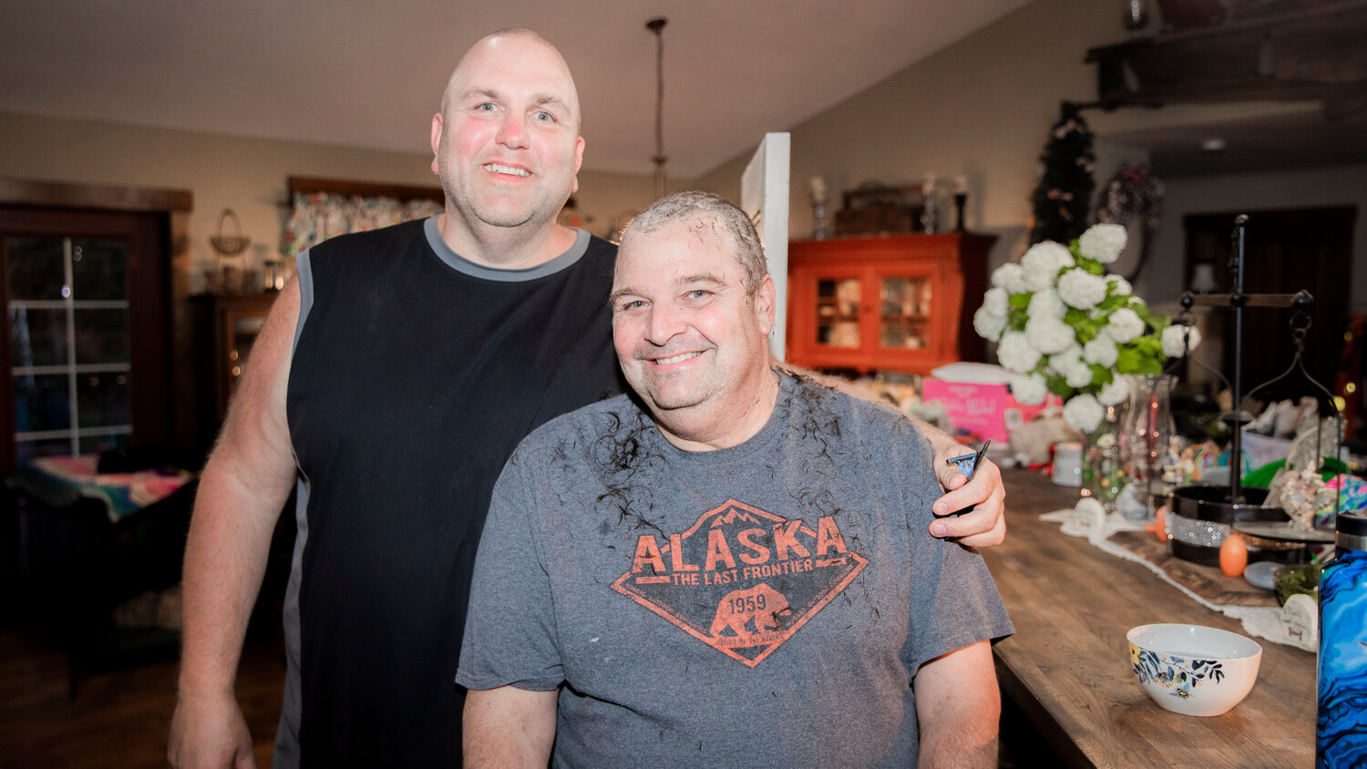 Ken Wiseman, right, smiles for a photo alongside Ty Vlach after they cut their hair to raise awareness for Tonja Vlach, a receptionist at I-5 Toyota, who is undergoing chemotherapy for breast cancer and an auction the family is holding online to raise funds this weekend.