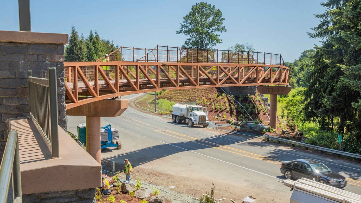Crews put finishing touches on landscape and infrastructure surrounding the newly opened section of the Willapa Hills State Park Trail in Littell on Friday, June 2.