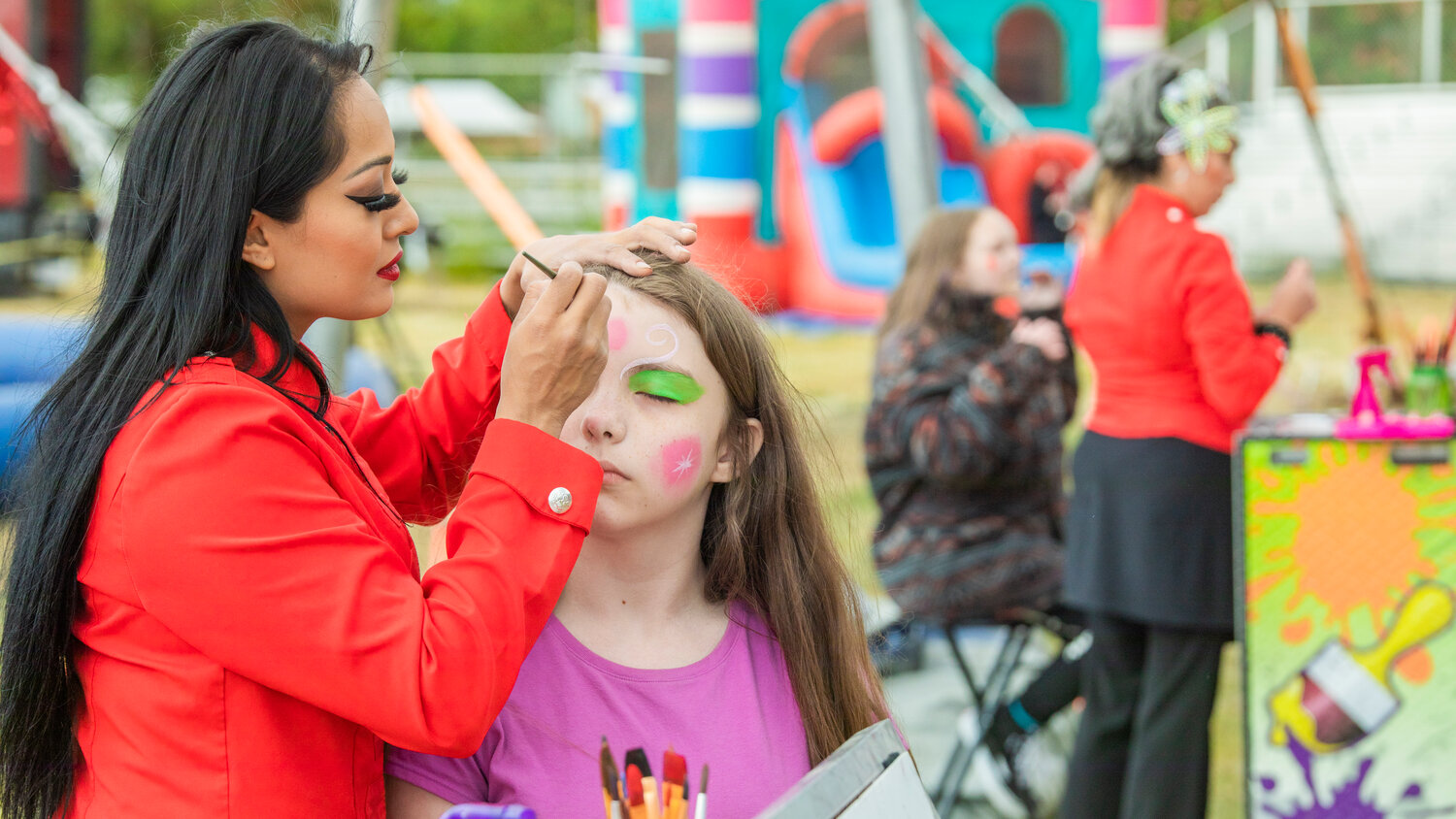 Attendees have their faces painted at the Southwest Washington Fairgrounds during the Jordan World Circus show on Wednesday, May 31.