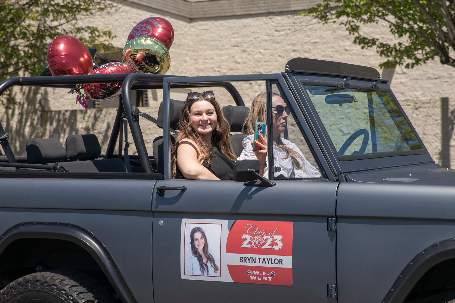 W.F. West High School senior Bryn Taylor smiles for a photo during a parade honoring future graduates in Chehalis on Sunday, June 4.