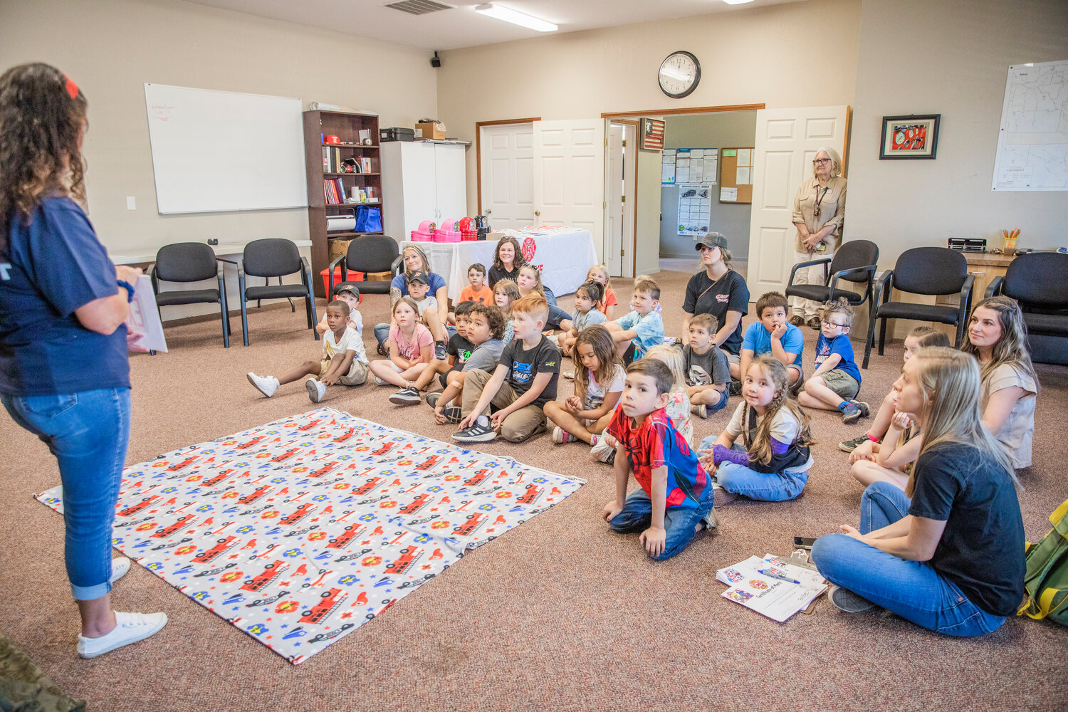 Kindergarten students listen to a presentation during a visit to Lewis County Fire District 5 in Napavine on Tuesday, June 7.