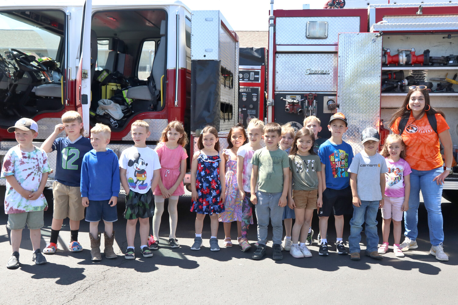 Students in Laura Stanley’s Napavine Elementary School kindergarten class pose for a photo outside a fire engine parked outside Lewis County Fire District 5 in Napavine on Tuesday, June 6.