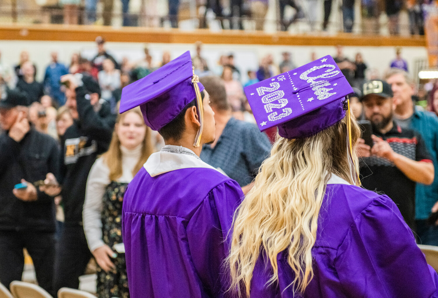 Decorated caps are worn as the Class of 2023 marches to Pomp and Circumstance on Friday, soon to become Onalaska High School’s 100th graduating class of seniors.