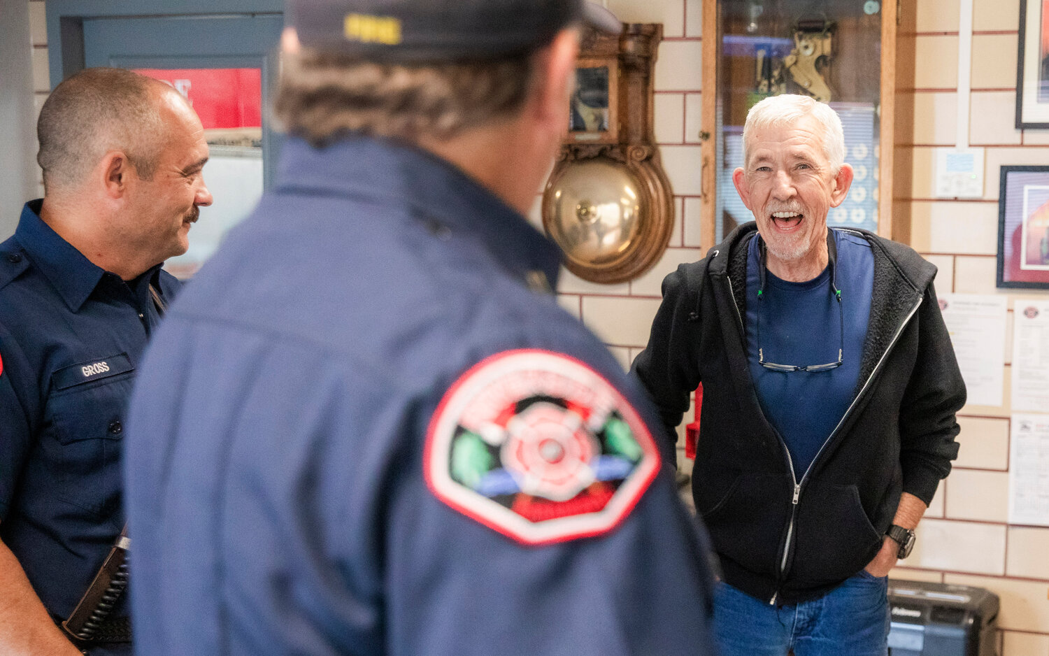 Scott Olson, 67, of Centralia, smiles while thanking Riverside firefighters for the work they do Wednesday morning. Crews from Riverside Fire Authority assisted an American Medical Response unit responding to the scene with firefighters using a defibrillator and CPR machine to stabilize Olson’s heart April 7, 2023.