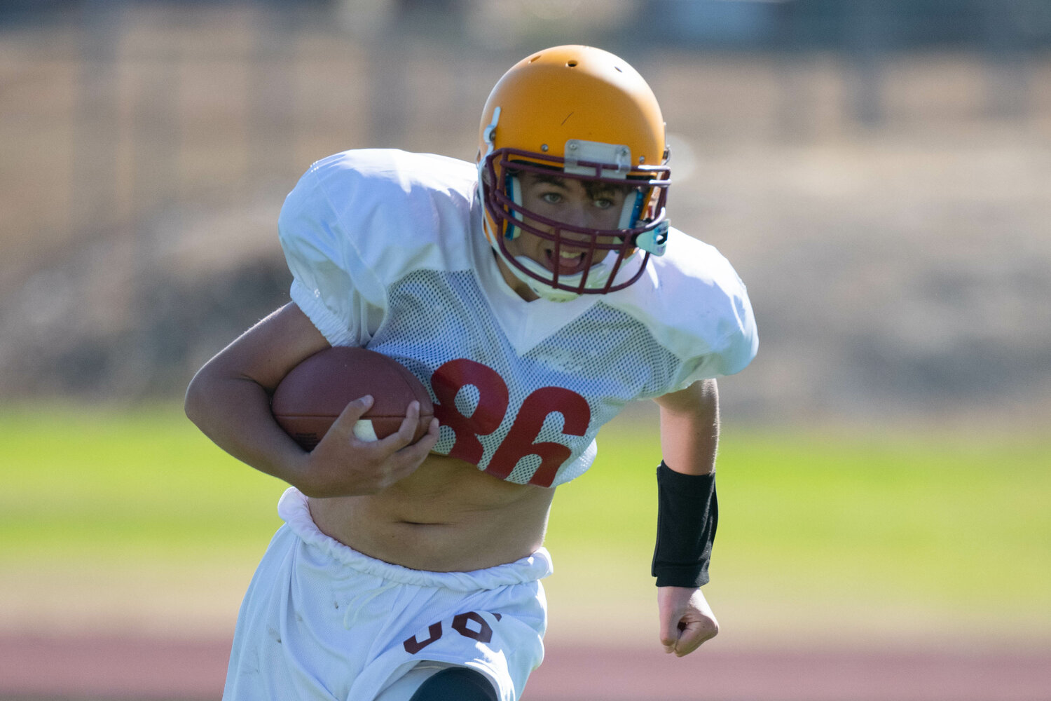 Julian Auve carries the ball at Winlock's practice on Aug. 19.