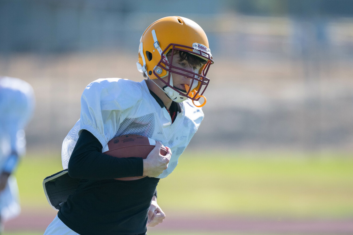 Carter Svenson carries the ball at Winlock's practice on Aug. 19.