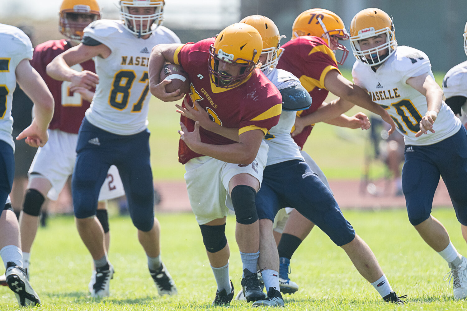 Winlock's James Cusson tries to fight through an arm tackle during the Cardinals' jamboree on Aug. 26.