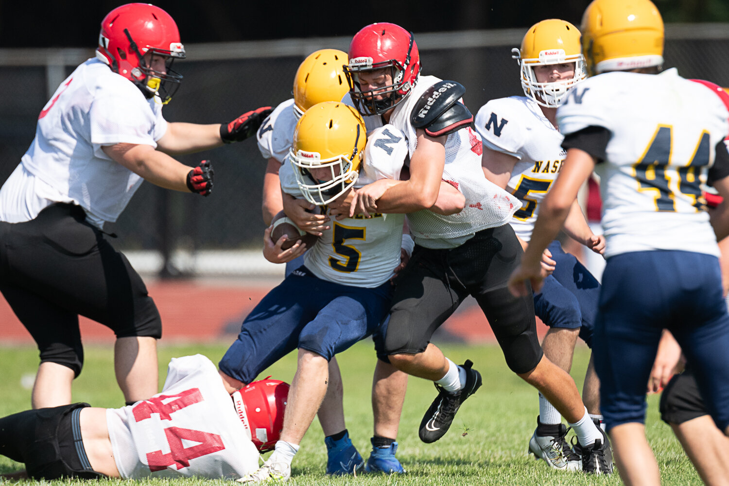 Mossyrock's Hunter Isom wraps up a Naselle ballcarrier at Winlock's jamboree on Aug. 26.