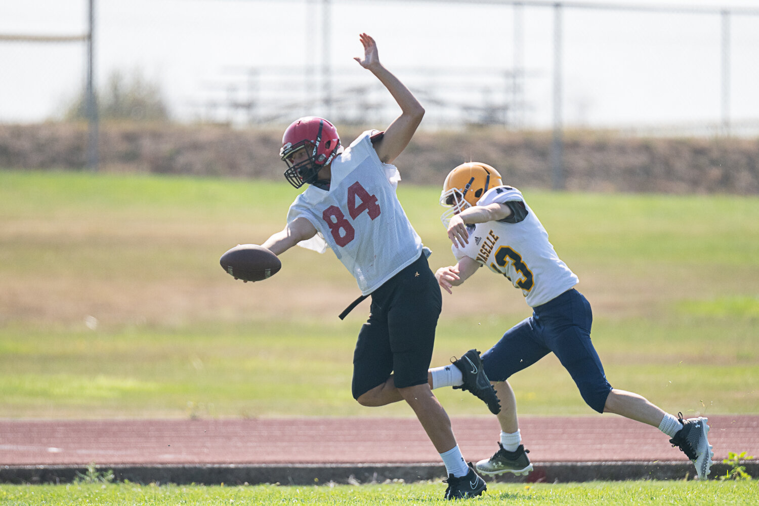 Mossyrock's Hunter Isom tiptoes along the sideline after making a catch at Winlock's jamboree on Saturday, Aug. 26.