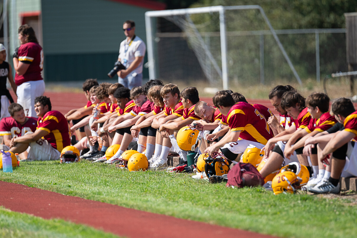 Winlock players sit and wait their turn at a jamboree with Mossyrock and Naselle on Saturday, Aug. 26.