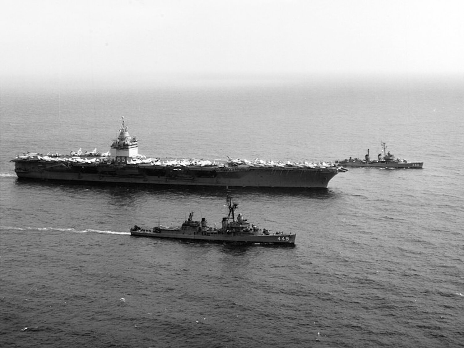The destroyers U.S.S. Nicholas, foreground, and U.S.S. O'Bannon escort the U.S.S. Enterprise in the Gulf of Tonkin on March 6, 1968. Photo courtesy the National Archives.