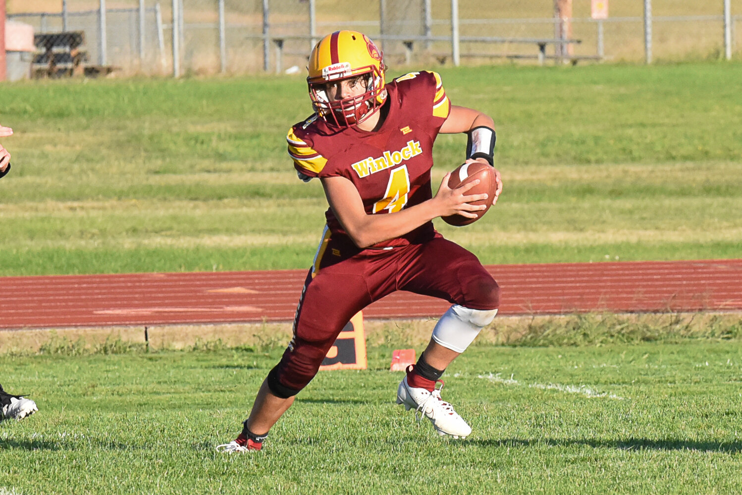 Landen Cline rushes the ball during Winlock's 56-14 loss to Darrington on Sept. 1.