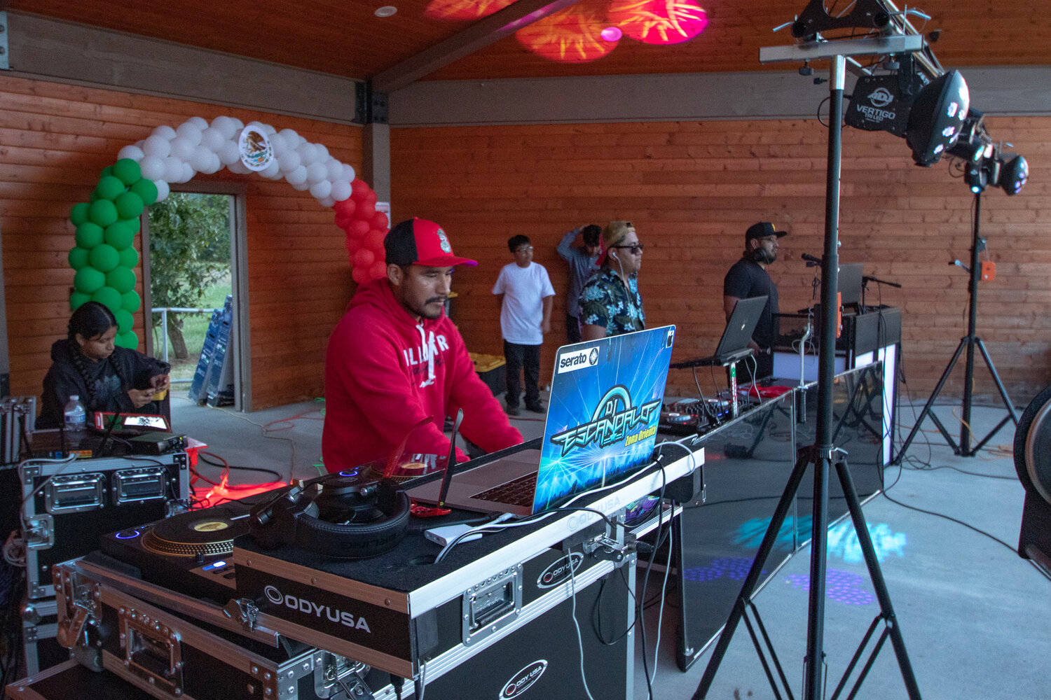 Members of DJ Escandalo Zona Orienta play dance music as the sun sets on Saturday, Sept. 16 during Mossyrock's Mexican Independence Day celebration at Klickitat Prairie Park.