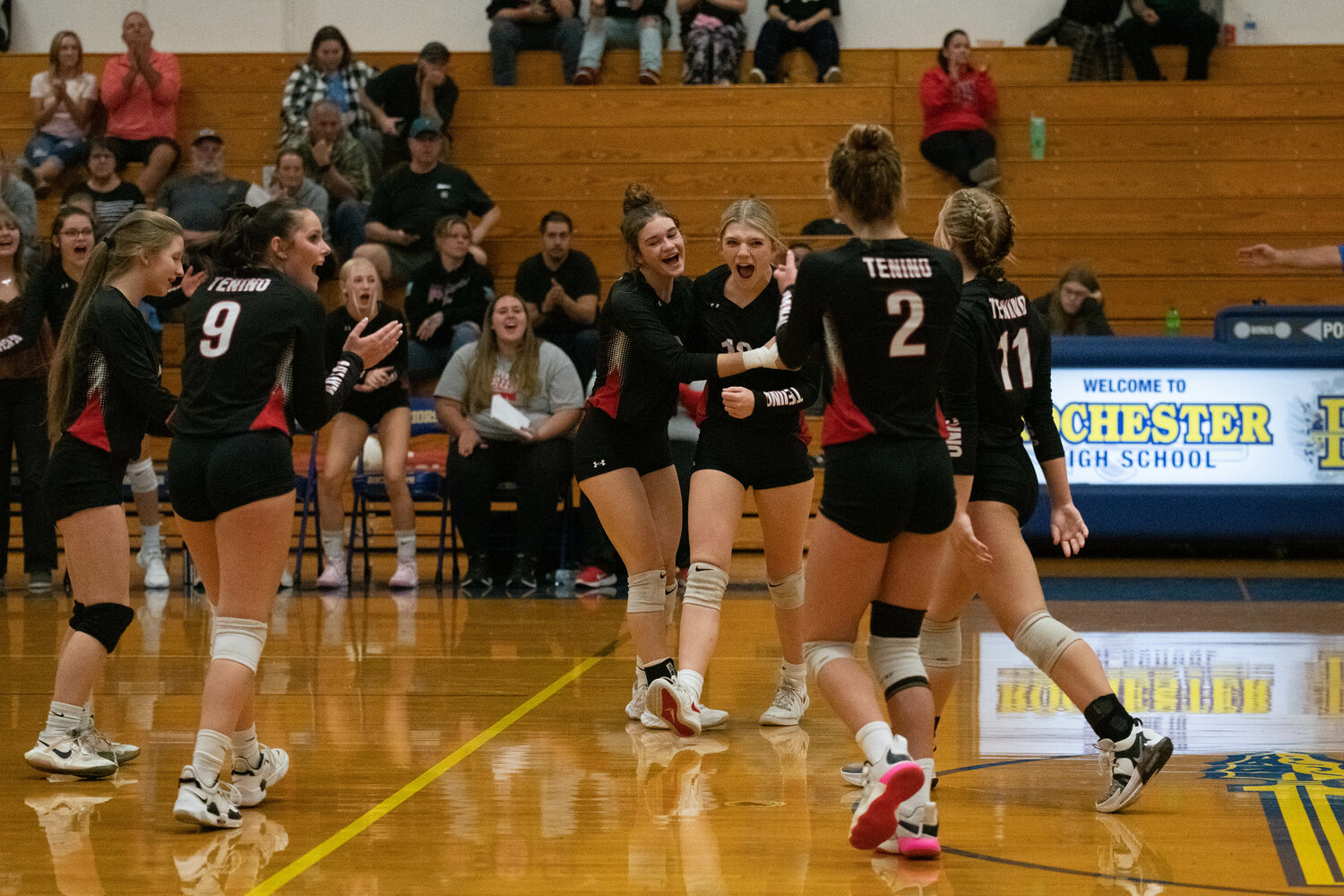 Tenino celebrates a point during its three-set win at Rochester on Sept. 18.