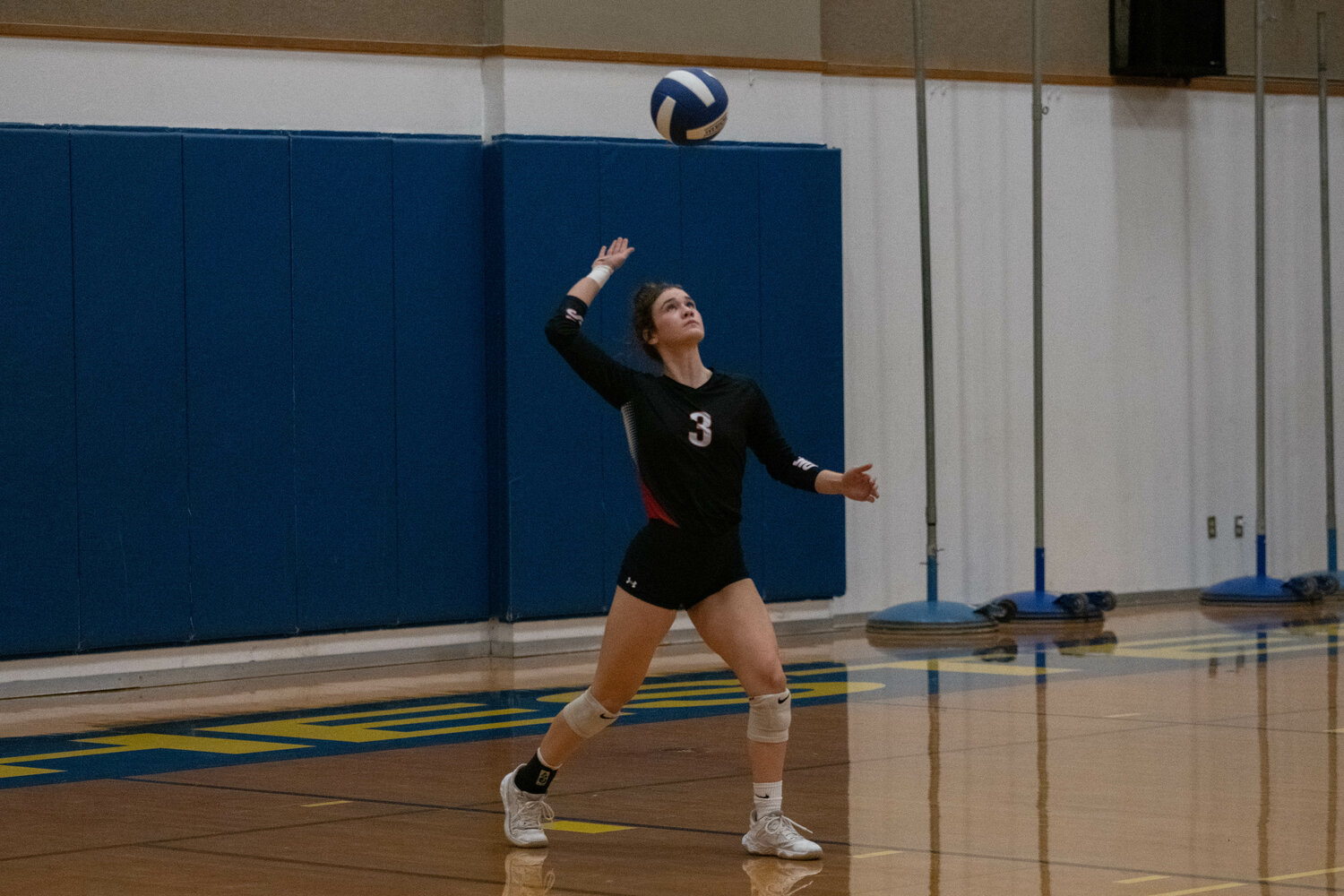 Brooke Bratton serves the ball during Tenino's three-set win at Rochester on Sept. 18.