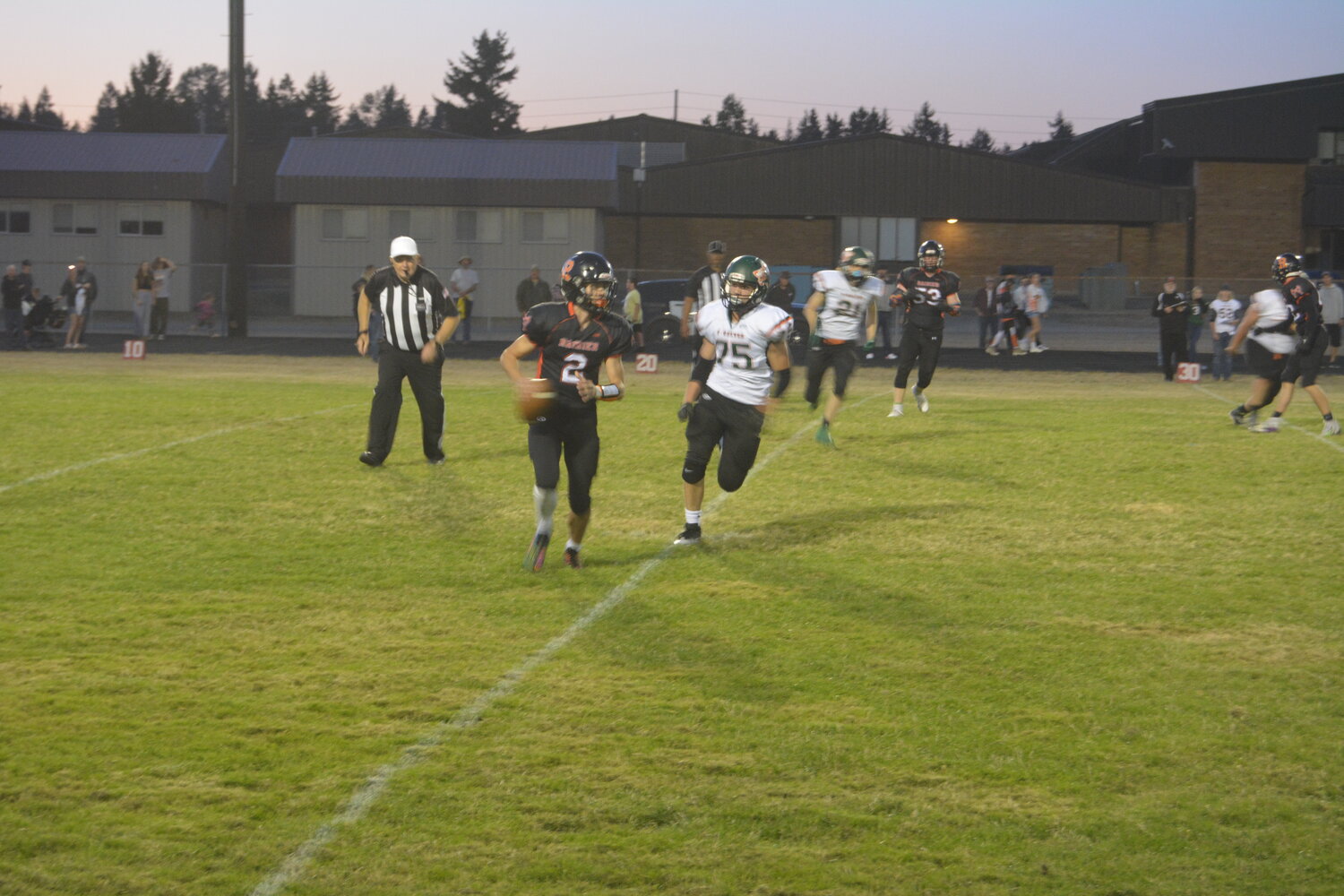 Jake Meldrum rolls out during Rainier's 56-26 win over MWP on Sept. 22.