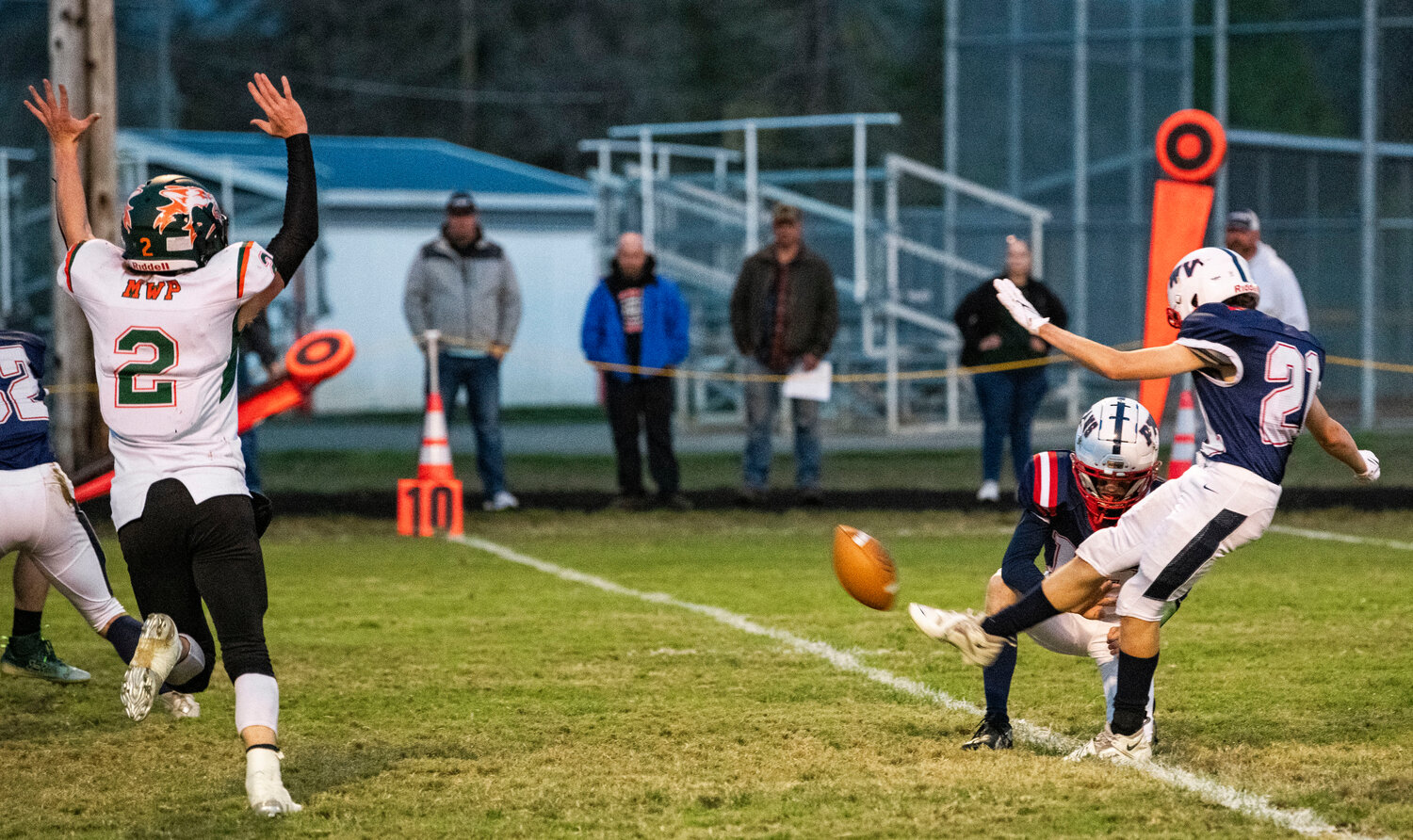 Pe Ell-Willapa Valley’s Aiden Silva (21) takes a kick as Morton-White Pass quarterback Judah Kelly seeks a block on Friday night in West Lewis County.