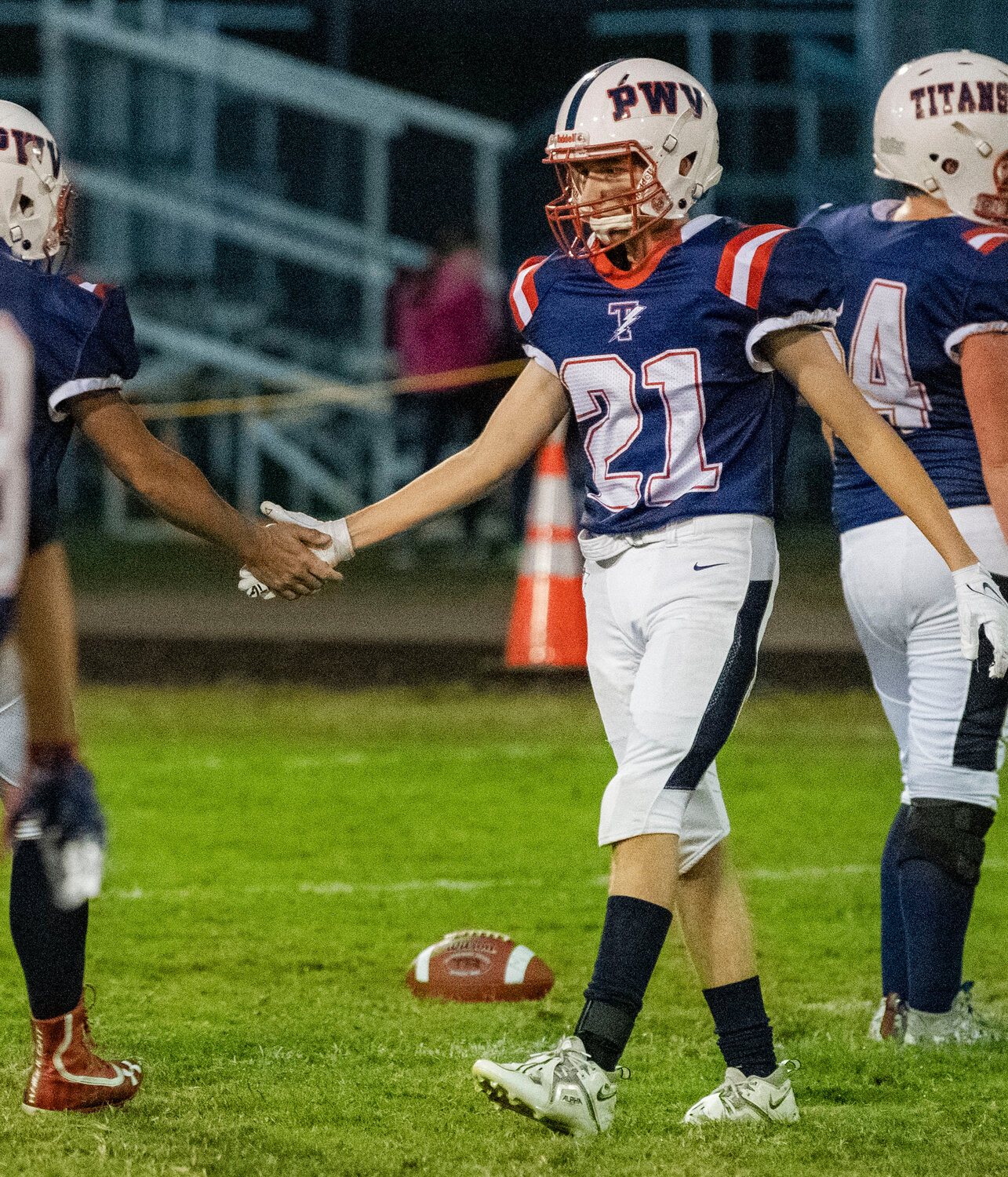 Pe Ell-Willapa Valley kicker Aiden Silva (21) gets a high-five from a teammate after a successful play against Morton-White Pass on Friday night in West Lewis County.
