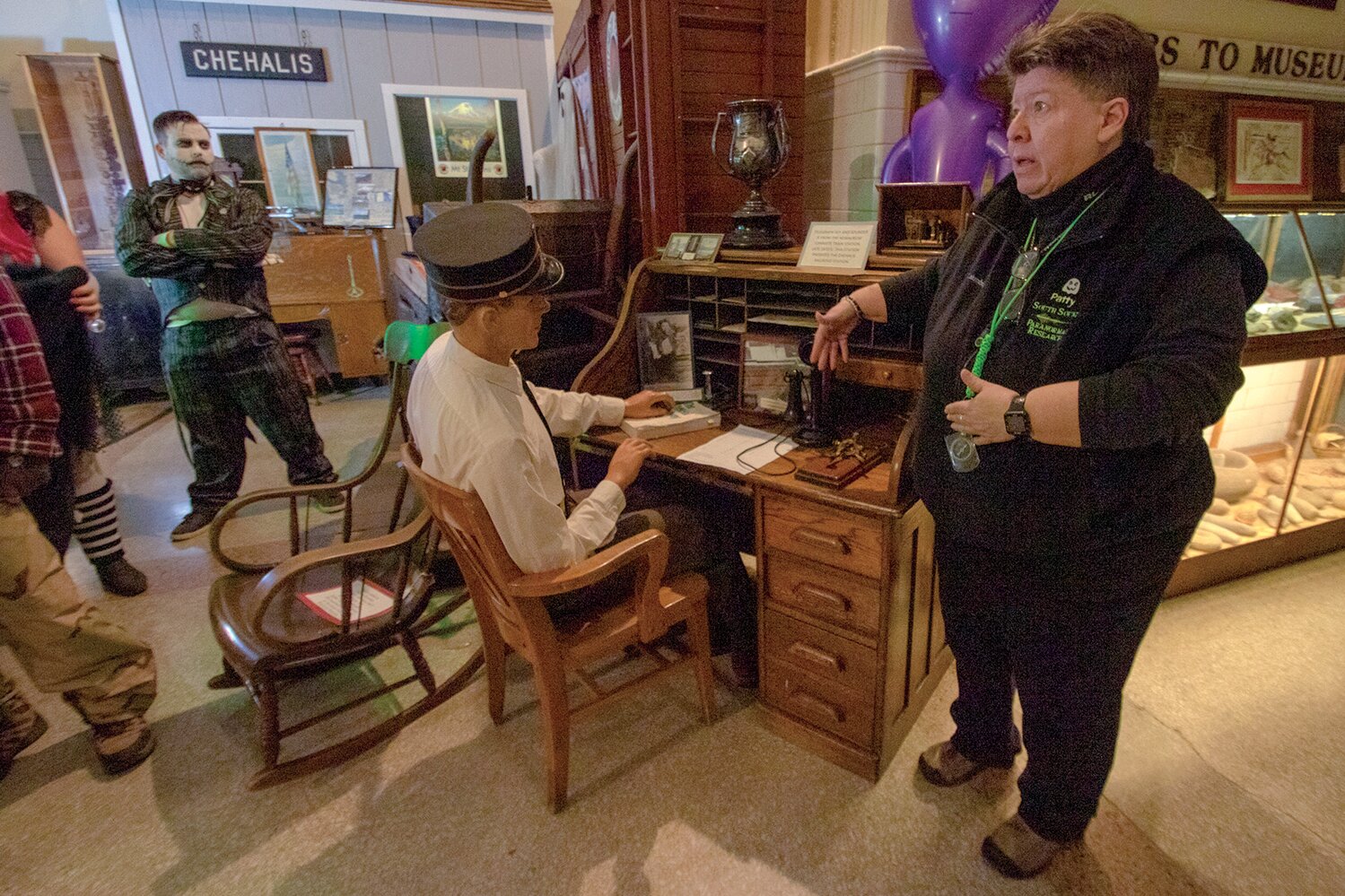 Patty Valdez of South Sound Paranormal Research explains to ghost tour attendees what she believes ghosts actually are at the Lewis County Historical Museum on Saturday, Oct. 28.