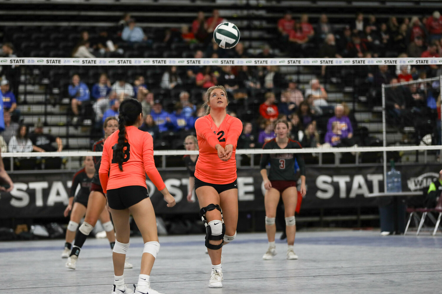 Dakota Hamilton bumps the ball behind her during Napavine's first-round matchup at the state tournament on Nov. 8 in Yakima.