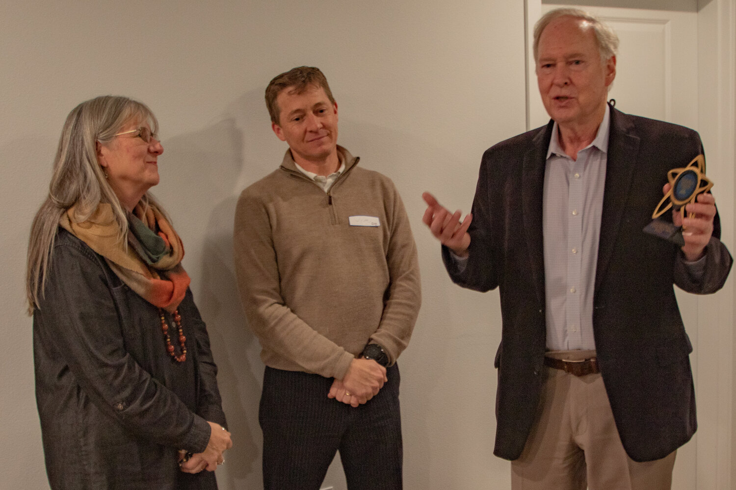 CHI managing members Joel Crosby, right, and Jim Lind, center, thank Centralia College Foundation executive director Christine Fossett for her help in completing the CHI apartments during an open house on Tuesday, Nov. 7.