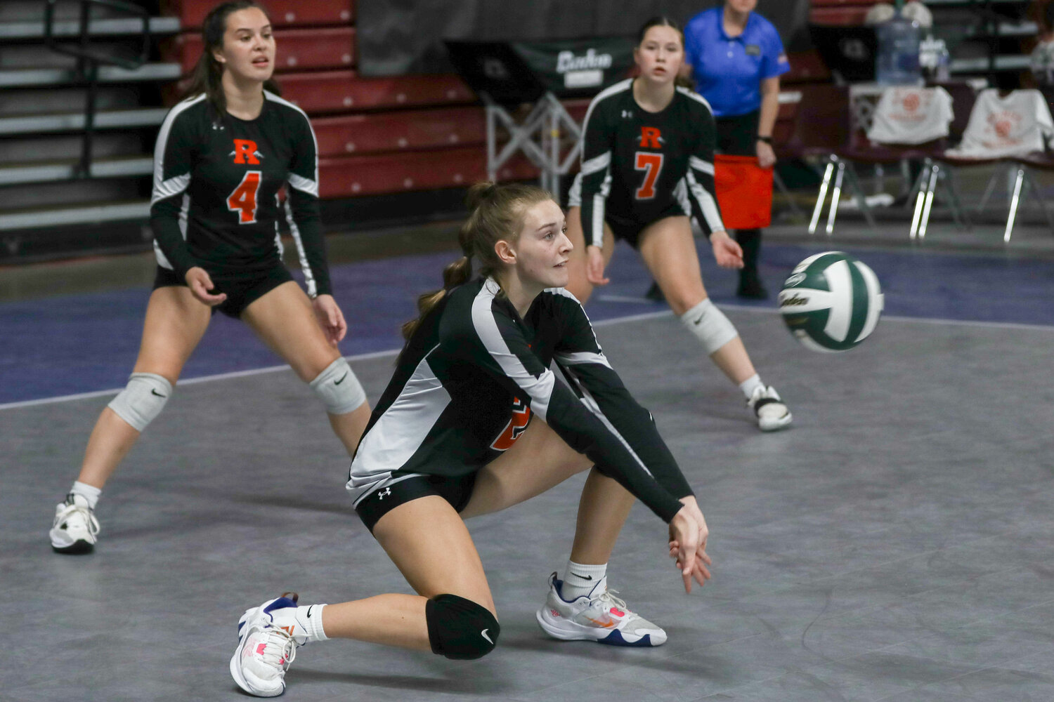 Anika Plowman digs a ball during Rainier's match against Adna in the state quarterfinals on Nov. 8 in Yakima.