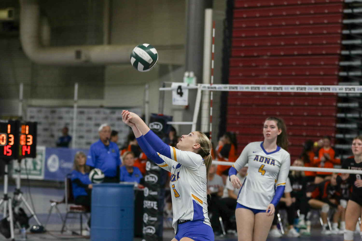 Gaby Guard bumps the ball over her head during a match at the state tournament on Nov. 9 in Yakima.
