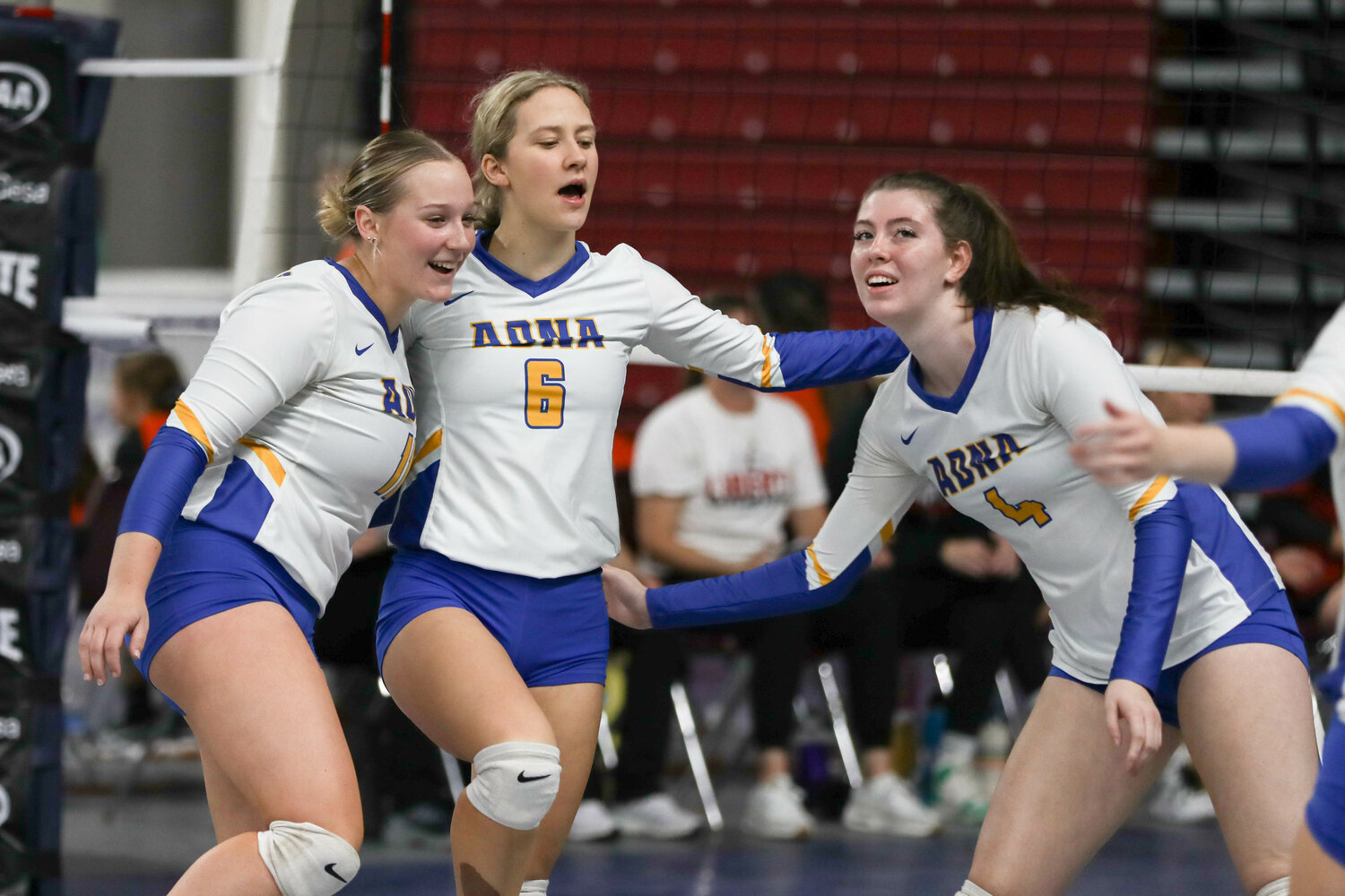 The Pirates celebrate after a point during a match at the state tournament on Nov. 9 in Yakima.