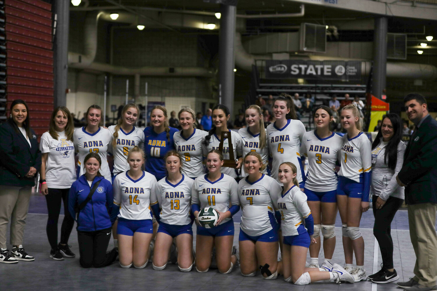 The Pirates pose with the fifth-place trophy after defeating Okanogan in the state tournament on Nov. 9 in Yakima.