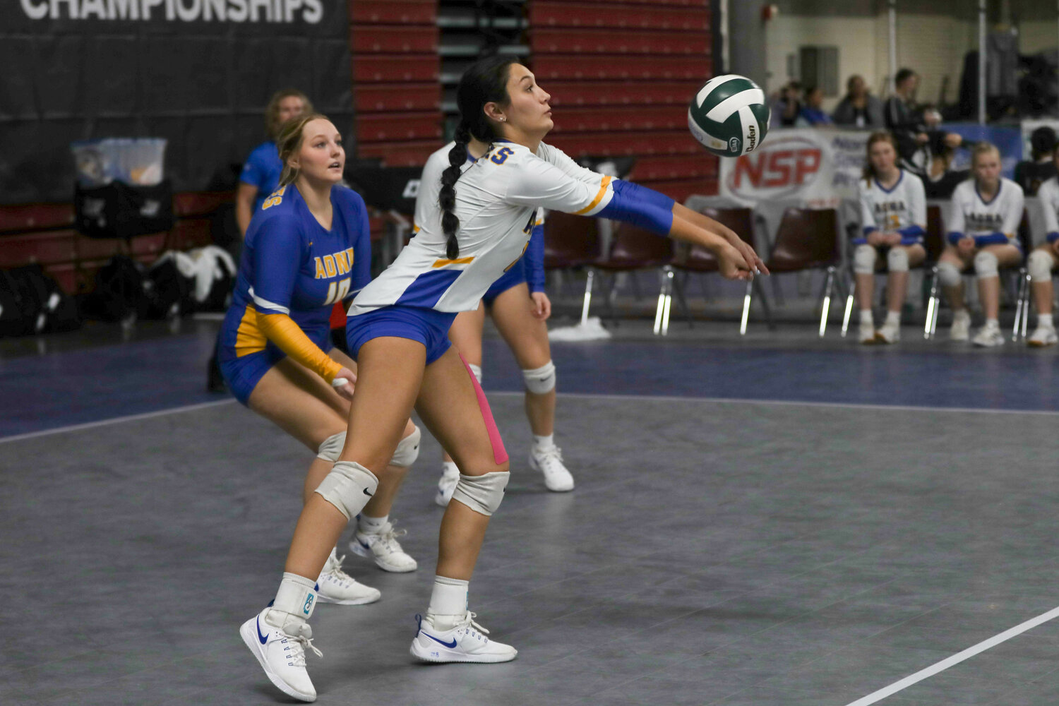 Charissa Schierman leans left to dig a ball during Adna's win over Okanogan in the fifth-place game at the state tournament on Nov. 9 in Yakima.