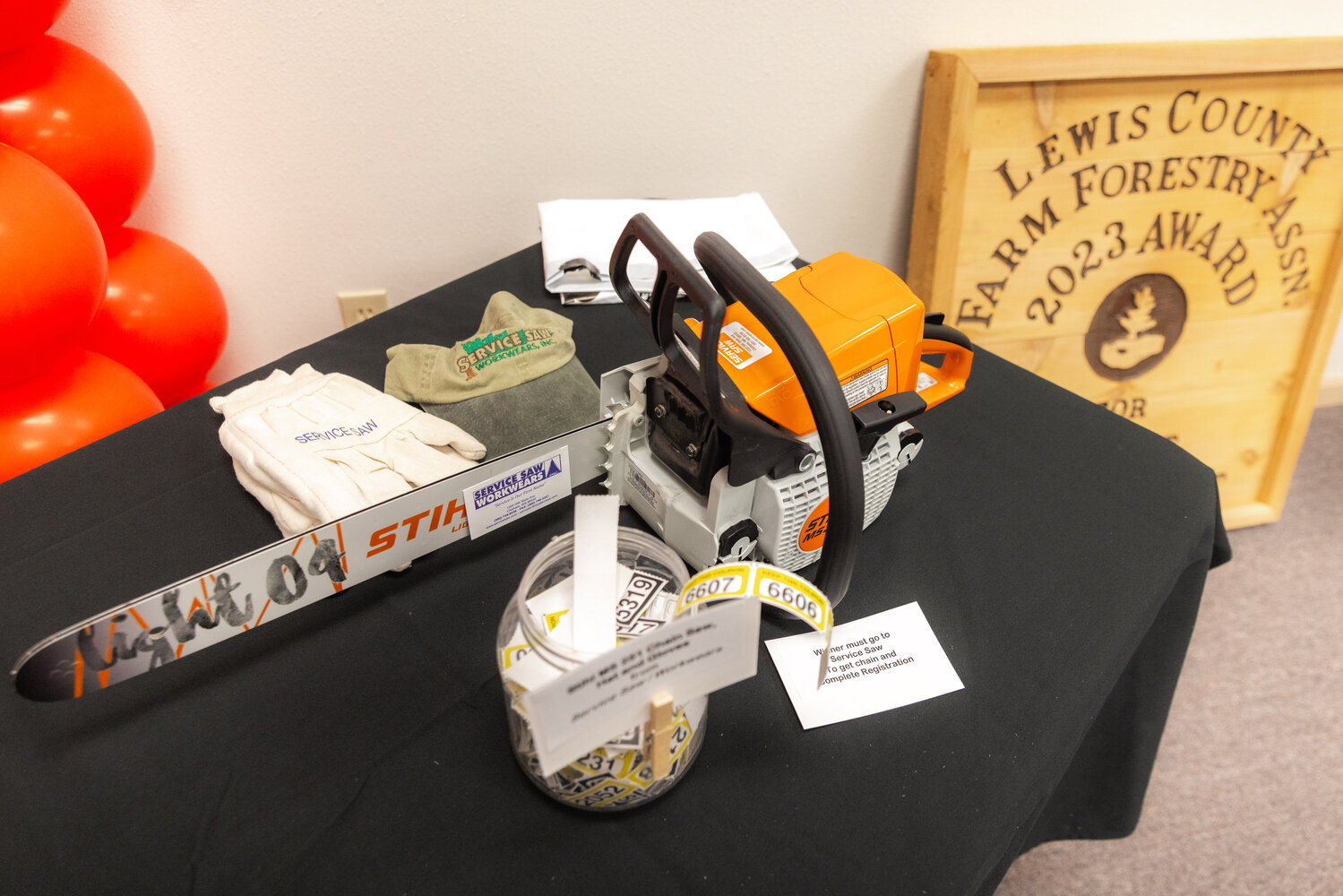 Raffle items sit on display during the Lewis County Farm Forestry Association awards banquet in Chehalis on Tuesday, Nov. 14.