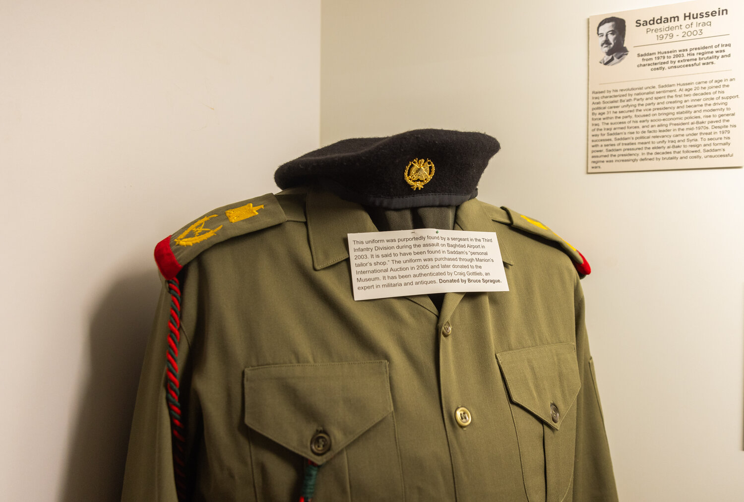 An authenticated outfit tailored for Saddam Hussein, one of three known to be in America, sits on display inside a case at the Veterans Memorial Museum in Chehalis on Tuesday, Nov. 14. The piece made a public debut on Veterans Day 2023.