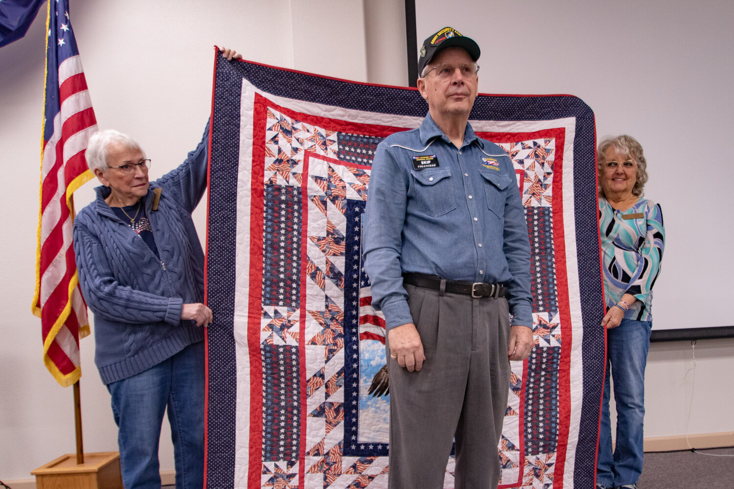 Veterans Memorial Museum Quilts of Valor chapter members present U.S. Army veteran Skip Greenwell with his quilt on Saturday, Nov. 11.