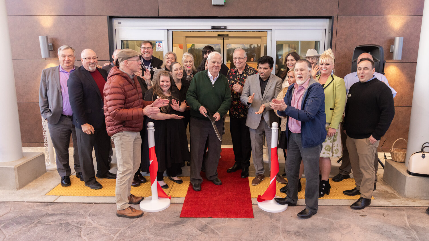 Attendees smile and clap during a ribbon cutting ceremony for La Quinta by Wyndham in Centralia on Wednesday, Nov. 15.