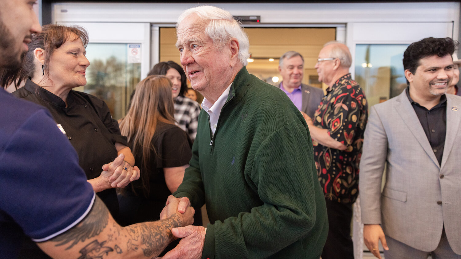 Brent Nicholson shakes hands with attendees following a ribbon cutting ceremony in Centralia on Wednesday, Nov. 15.