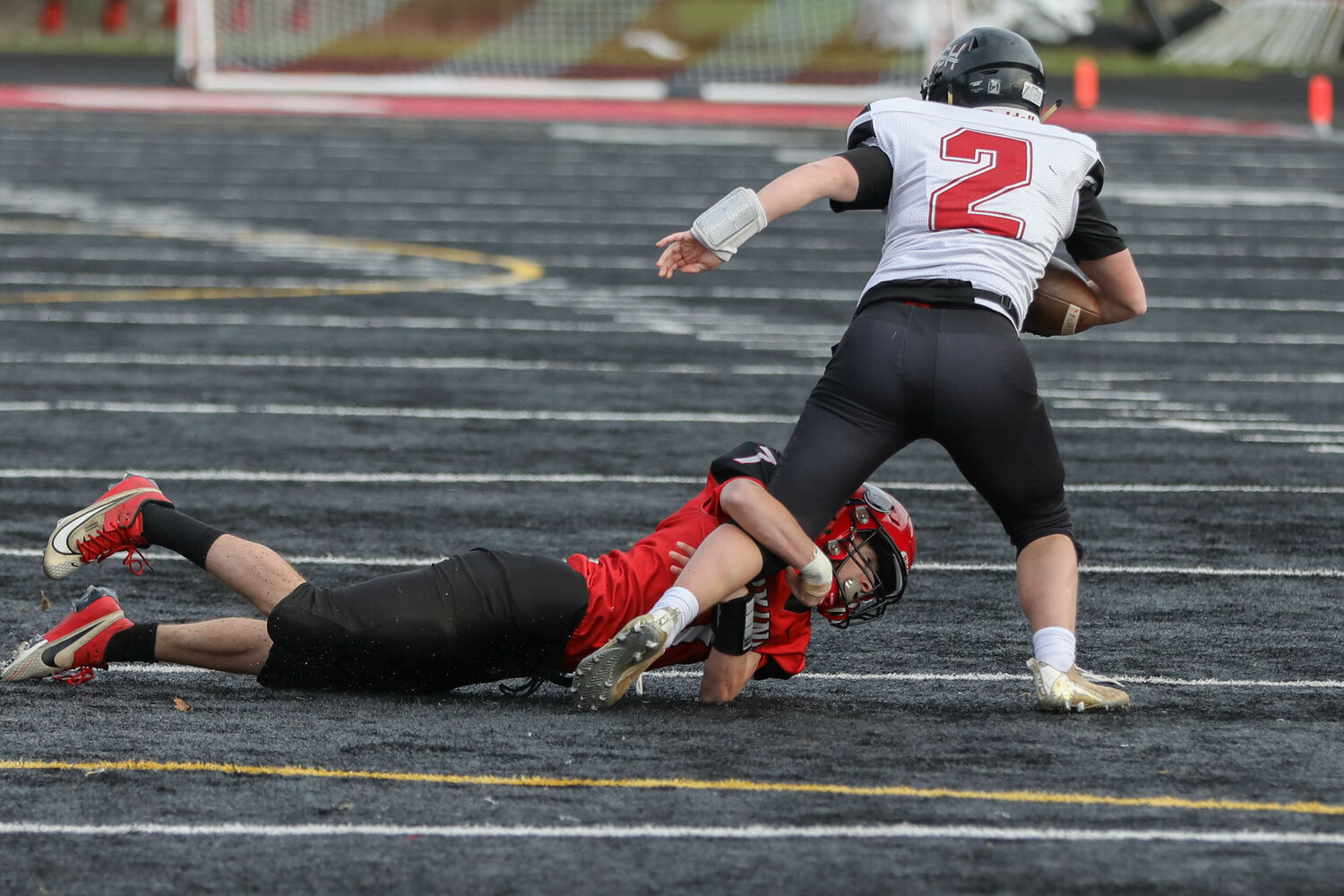 Peyton McClure wraps up a ballcarrier during Mossyrock's 46-30 win over Almira-Coulee-Hartline in the 1B state quarterfinals, Nov. 18 in Tenino.