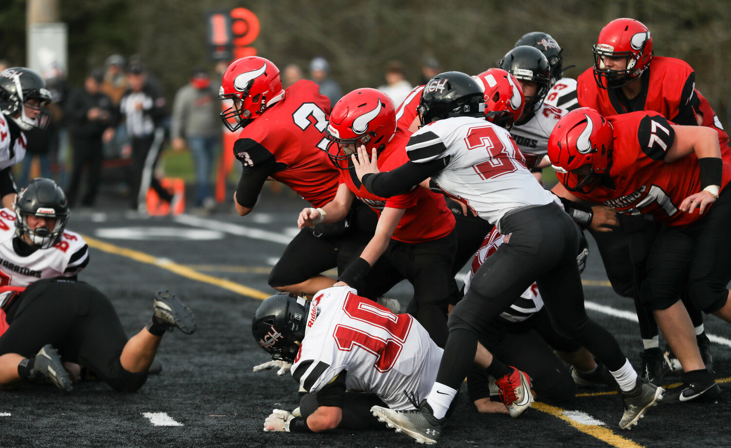 Easton Kolb bursts through a pile on a sneak during Mossyrock's 46-30 win over Almira-Coulee-Hartline in the 1B state quarterfinals, Nov. 18 in Tenino.